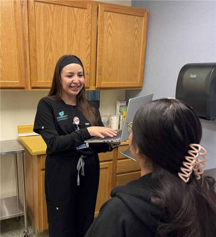 CCHCI MA with Logo helping patient